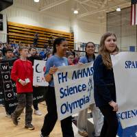Participants marching with their school banners
